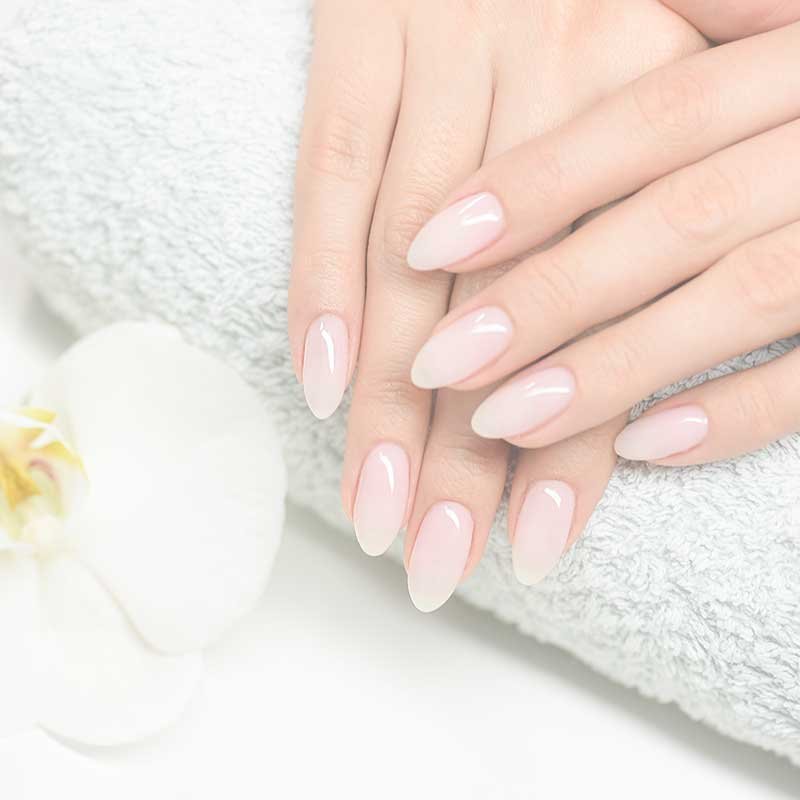 Womens hands showing elegant nail extensions.